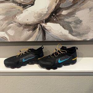 Nike Black and Blue Athletic Shoes with Traction Sole and Lace-Up Closure